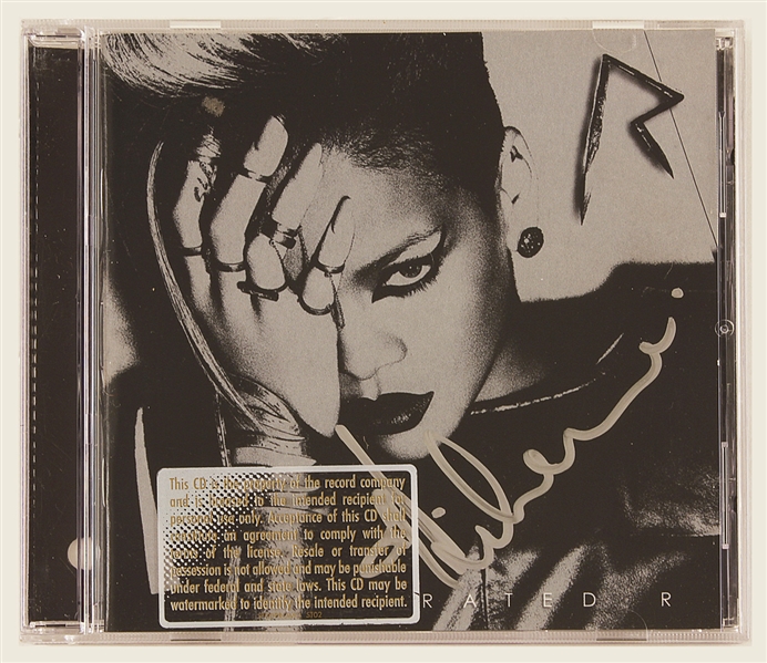 Rihanna Signed "Rated R" C.D. Insert and Laminate
